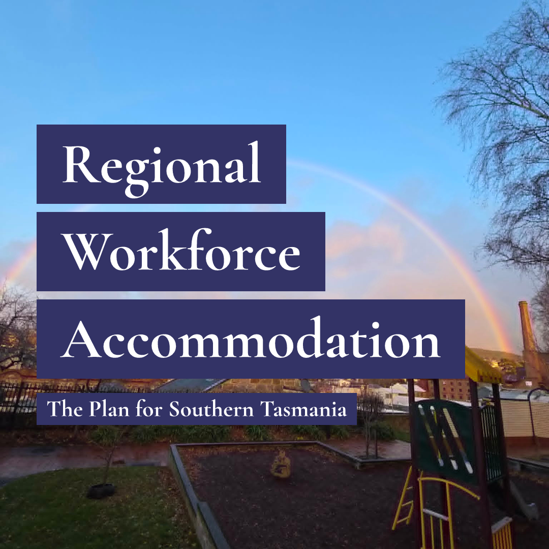 Text reading Regional Workforce Accommodation over a playground and buildings with a rainbow in the sky.