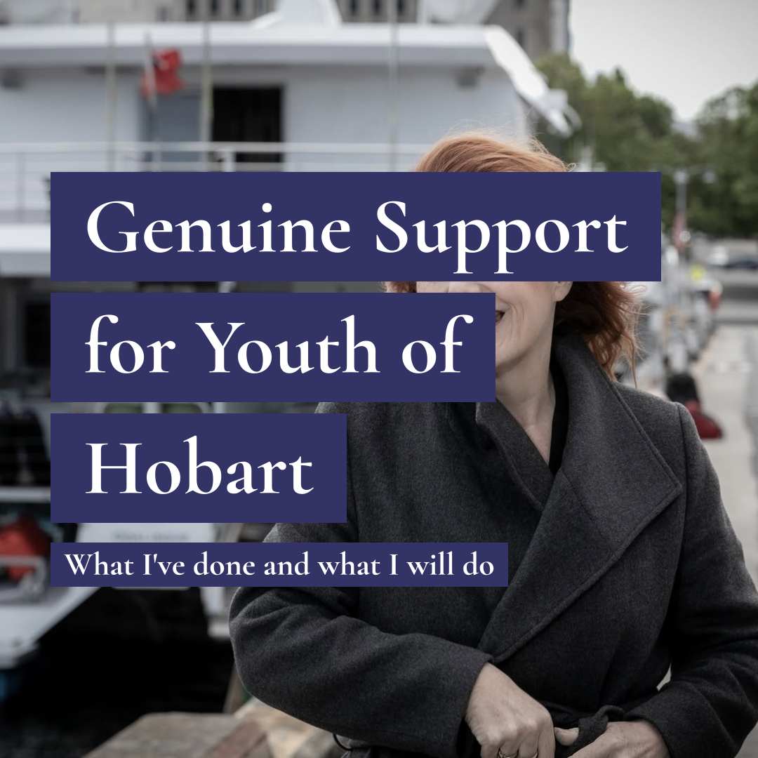 A smiling woman in a grey coat in front of a boat with text: Genuine Support for Youth of Hobart.