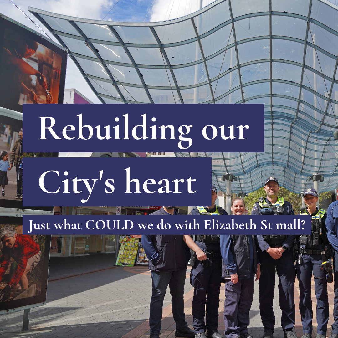 Police officers and community members under the Elizabeth Street Mall canopy with text: Rebuilding our City's heart. Just what COULD we do with Elizabeth St mall?